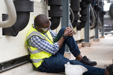 Male worker accident with broken leg at sewer pipes area at construction site. Health insurance concept