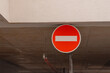 © Григорий Галасюк - a round red road sign hangs on the roof of the entrance to the parking lot. Tools for regulating traffic and parking rules.