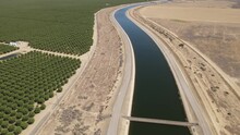 Aerial Shot Of One Of The Aqueducts Running Through California's Central Valley That Supplies Water To Los Angeles And Southern California.
