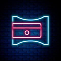 Poster - Glowing neon line Pencil sharpener icon isolated on brick wall background. Colorful outline concept. Vector