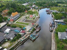 Drone View Of Wat Tha Phae Temple Next To Tha Phae River In Nakhon Si Thammarat With Greenery Around