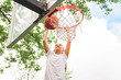 © Louis-Paul Photo - portrait of a kid girl playing with a basketball in park
