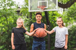 © Louis-Paul Photo - three teens in sportswear playing basketball game