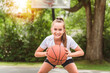 © Louis-Paul Photo - girl with basketball on court on summer season