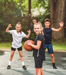 © Louis-Paul Photo - great child Team in sportswear playing basketball game