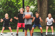 © Louis-Paul Photo - great child Team in sportswear playing basketball game