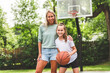 © Louis-Paul Photo - Mother and little daughter play basketball outside