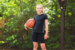© Louis-Paul Photo - portrait of a kid girl playing with a basketball in park