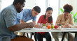 © atitaph - male and female students and African teachers Doing drawing and painting activities