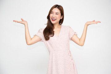 Wall Mural - Happy young Asian woman presenting or showing open hand palm with copy space for product isolated on white background