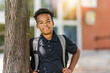 © Louis-Paul Photo - Smiling african american school boy with backpack