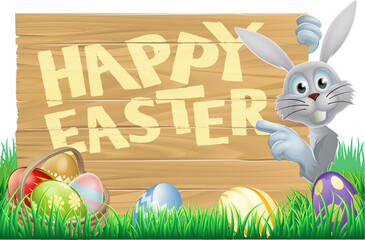 Wall Mural - Bunny pointing at Happy Easter message