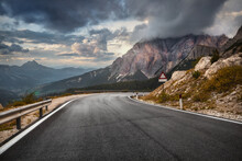 Highway In Mountains In Autumn Evening In Italy. Beautiful Landscape With Roadway. Empty Asphalt Road Against The Backdrop Of A Beautiful Rock. Dolomites, Alps