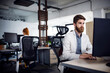 © Cavan Images - Businessman using desktop computer in creative office