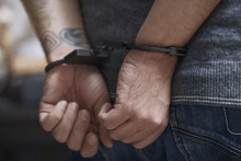 Midsection Of Criminal In Handcuffs