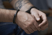 Cropped Image Of Criminal In Handcuffs