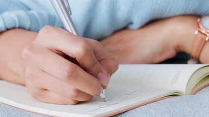 Poster - Woman hands writing in notebook, journal or dairy with pen planning design, fashion or business strategy idea. Creative, freelance girl writer working and write a motivation draft or sample in a book