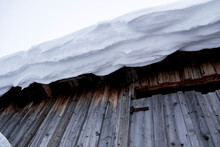 Low angle view of snow covered on building roof