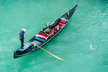 High Angle View Of Gondolier Oaring While Standing On Gondola