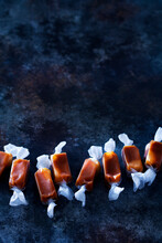 High angle view of caramel candies arranged on table