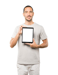 Young man doing gestures using a tablet