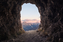 Scenic View Of Passo Falzarego Against Sky During Sunset Seen Through Cave