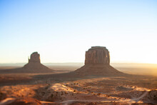 Tranquil View Of Rock Formations In Monument Valley Against Sky At Desert During Sunrise
