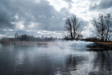Scenic View Of River Against Cloudy Sky