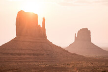 Tranquil View Of Rock Formations On Desert Against Sky At Monument Valley During Sunset