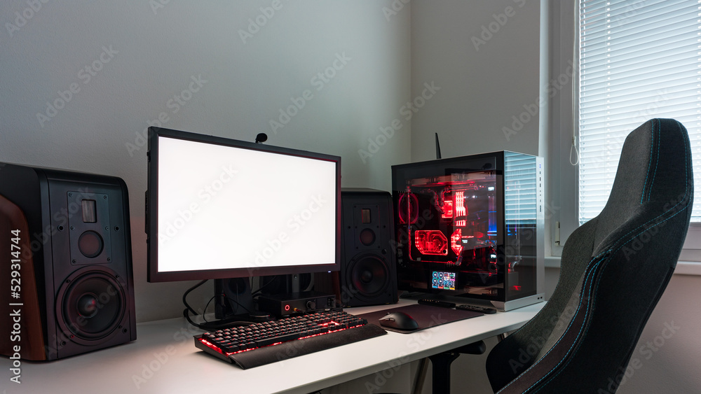 Powerful personal computer gamer rig with white screen. Professsional ...