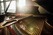 Close-up Of Piano At Home During Sunny Day