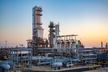 Industrial Equipment Against Clear Sky At Oil Refinery During Sunset