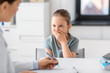 © Syda Productions - medicine, healthcare and pediatry concept - female doctor or pediatrician with clipboard and coughing little girl patient on medical exam at clinic