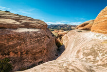 Scenic View Of Mountains Against Blue Sky During Sunny Day At Canyonlands National Park