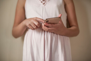 Young girl hits buttons on brand new phone