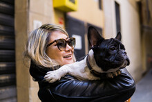 Woman Is Keeping A French Bulldog