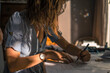 © Cavan Images - Young woman drawing architect plans on desk