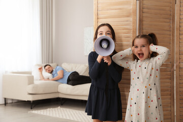 Sticker - Cute little children with megaphone waking up their father at home