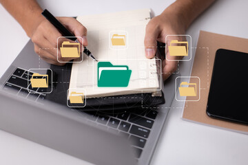 Aufkleber - Paperless office concept based on e-documents. A businessman types on a laptop keyboard while viewing electronic document icons on a virtual screen.