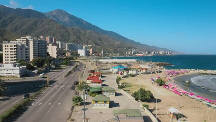 Wall Mural - Aerial view picturesque public beach with turquoise water. Los Corales, La Guaira, Venezuela.