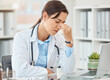 © Anela Ramba/peopleimages.com - Headache pain, doctor stress and burnout from hospital work on laptop, sad about mental health problem and anxiety working in healthcare. Tired medical nurse with depression and mistake at clinic