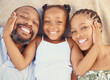 Love, care and happy black family bonding, relax and rest together at home from above. Portrait of smile parents enjoying time with their child, showing affection and being loving with their daughter