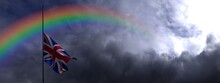 UK Flag In Half Mast And Rainbow. United Kingdom Flag Against Dark Dramatic Cloudy Sky With Colorful Rainbow. 3D Render British Flag Illustration