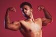 Fitness health, strong muscles and sports man with healthy body against red mockup studio background. Mock up of thinking, sport and Indian professional bodybuilder and weightlifter flexing muscle