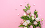 Fototapeta Tulipany - Festive bouquet of flowers for the beloved on a pink background. The concept of love congratulations on the wedding, March 8, Valentine's Day, Christmas and birthday. Copy space.