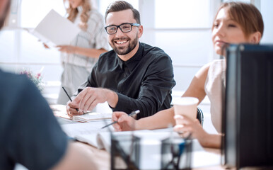 Poster - businessman at a meeting with his business team