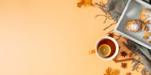 Autumn Cozy Composition. Cup Of Tea With Lemon, Cookies Cinnamon Sticks Anise Stars Candle Yellow Leaves On Wooden Tray And Scarf On  Isolated Beige Background. Autumn, Fall Concept. Flat Lay, Top Vie