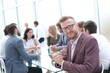 © ASDF - close up. smiling young businessman showing thumbs up.