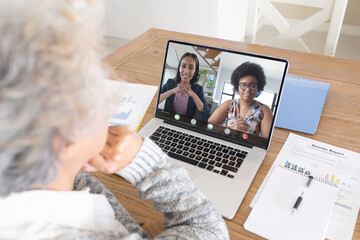 Poster - Senior caucasian woman making laptop video call with two diverse female colleagues