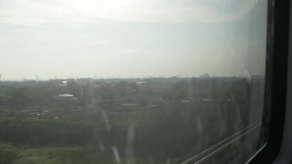 Canvas Print - outside view while riding airpiort rail link skytrain with local landscape view of bangkok